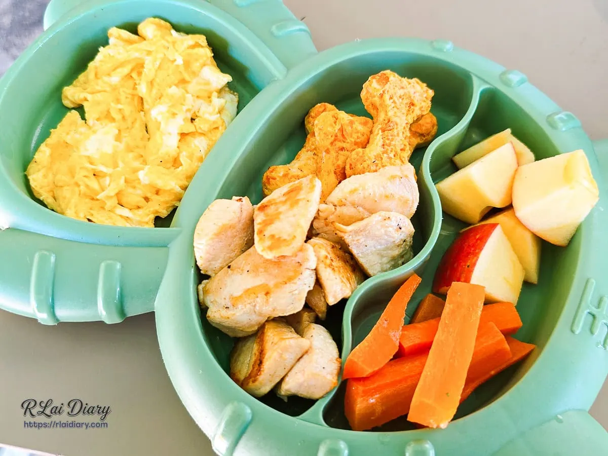 寵物餐盒特寫，包含嫩雞胸、炒蛋與健康蔬果