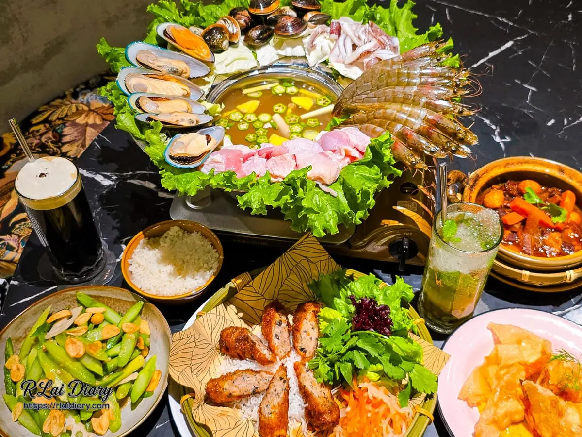 越越新越南料理整桌澎湃菜色合照，包含海陸推推鍋、各式招牌菜與飲品