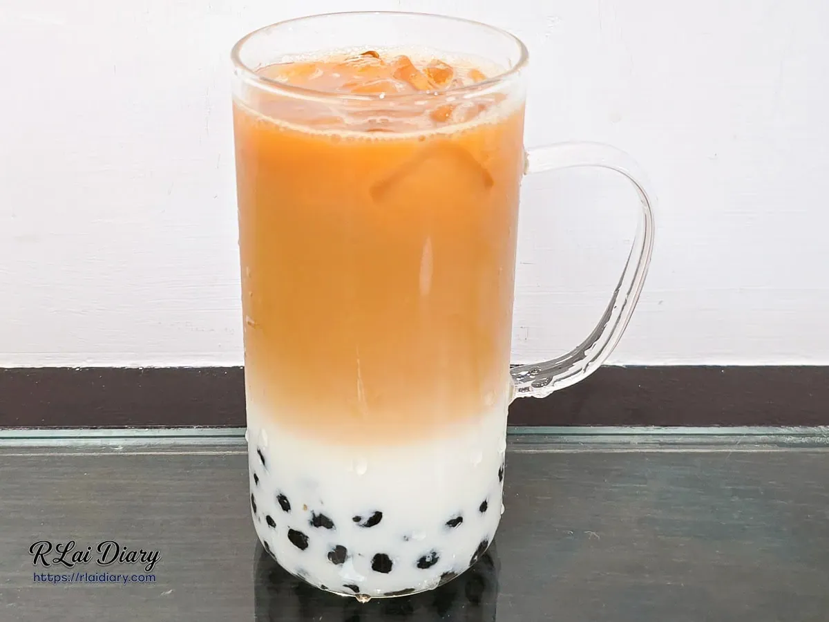 米堤銀行大安店經典珍珠紅茶鮮乳絕美琥珀色茶湯與純白鮮乳漸層