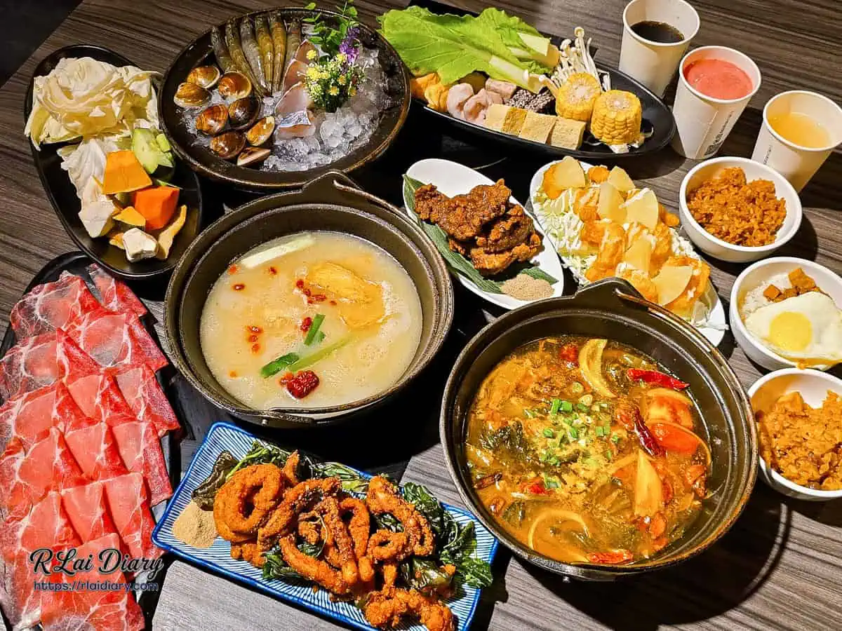 狂一鍋整桌豐盛餐點合照,包含各種湯底、炸物、海鮮肉盤與飲料