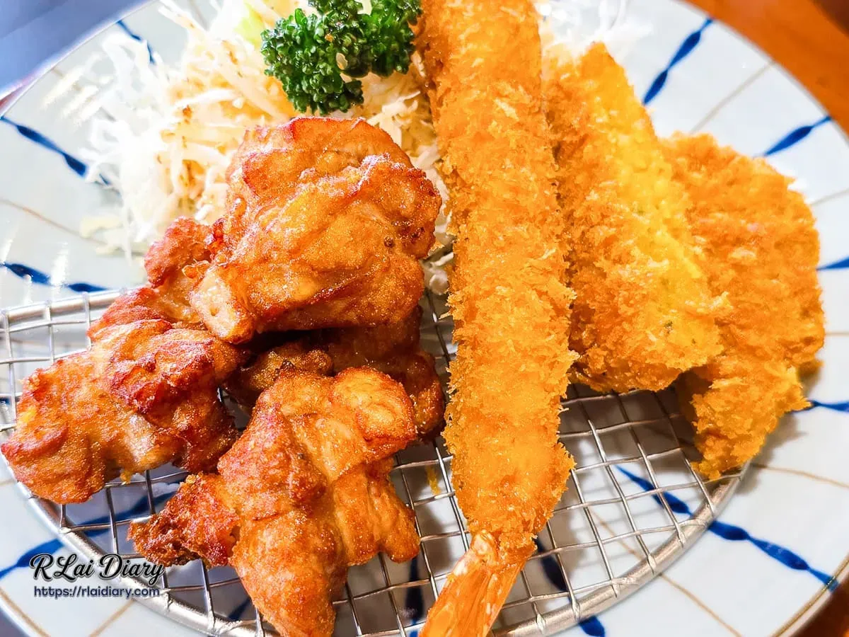 盛合拼盤細節特寫呈現炸大蝦與南瓜可樂餅