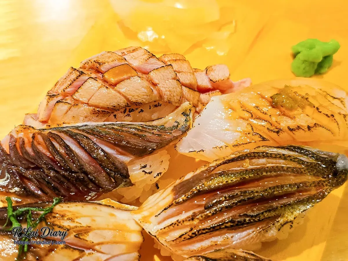 OMAKASE・食卓展現細緻刀工與焦香油脂的炙燒魚肉握壽司