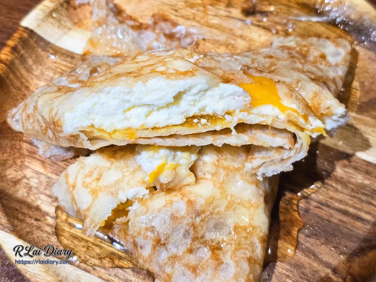 滿滿鮮奶油與島嶼果香：新鮮芒果可麗餅切開後的爆漿邪惡斷面