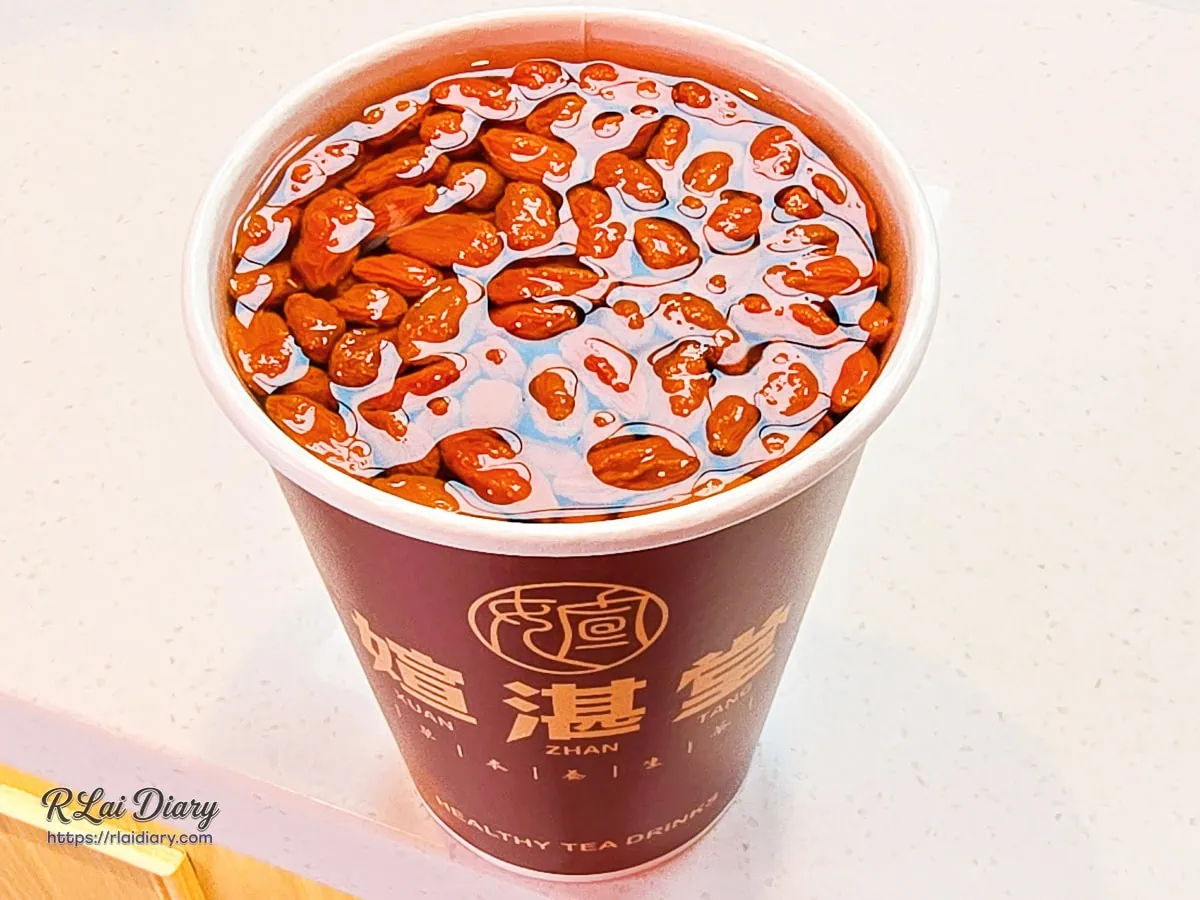 紙杯裝媗湛堂枸杞菊花茶，散發天然果木甘甜